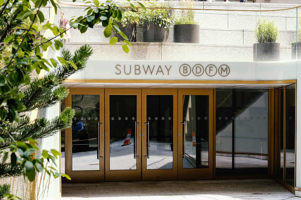 An outdoor entrance to a subway station in new york city